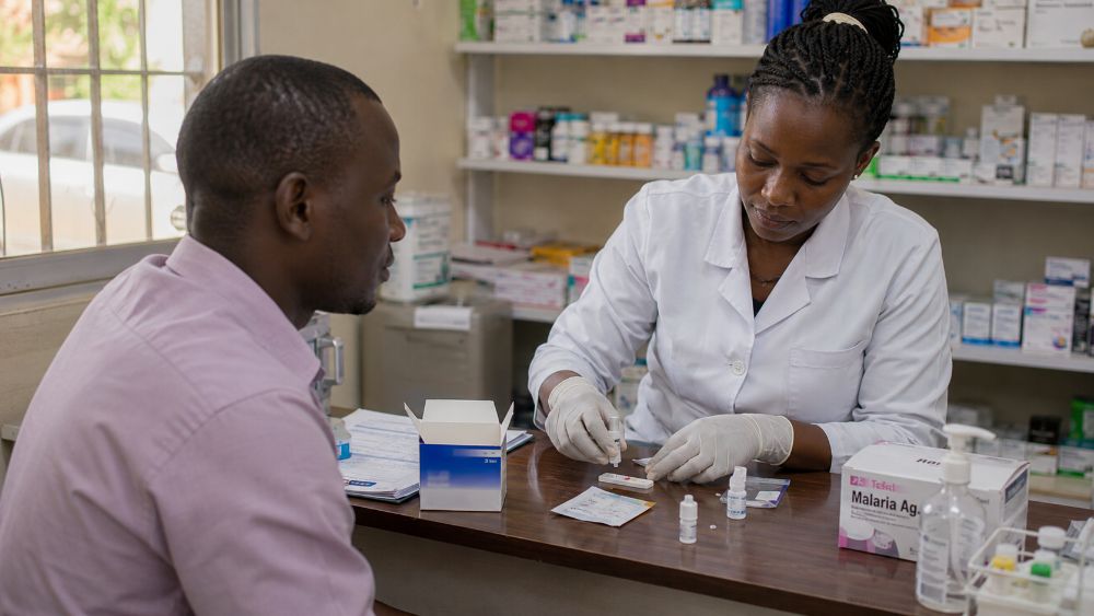 Healthcare worker carrying out a malaria test