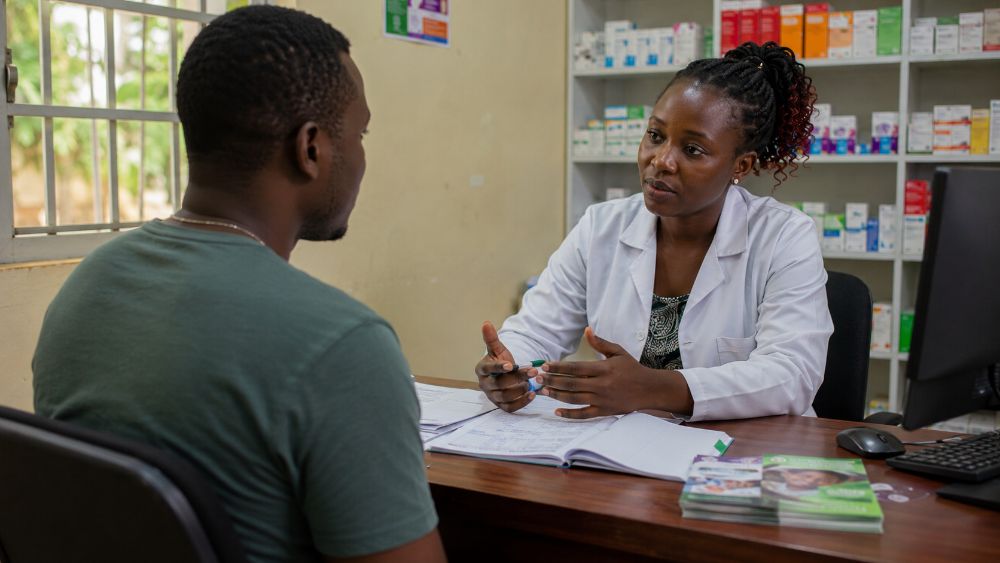 Healthcare worker discussing HIV PrEP services with a customer